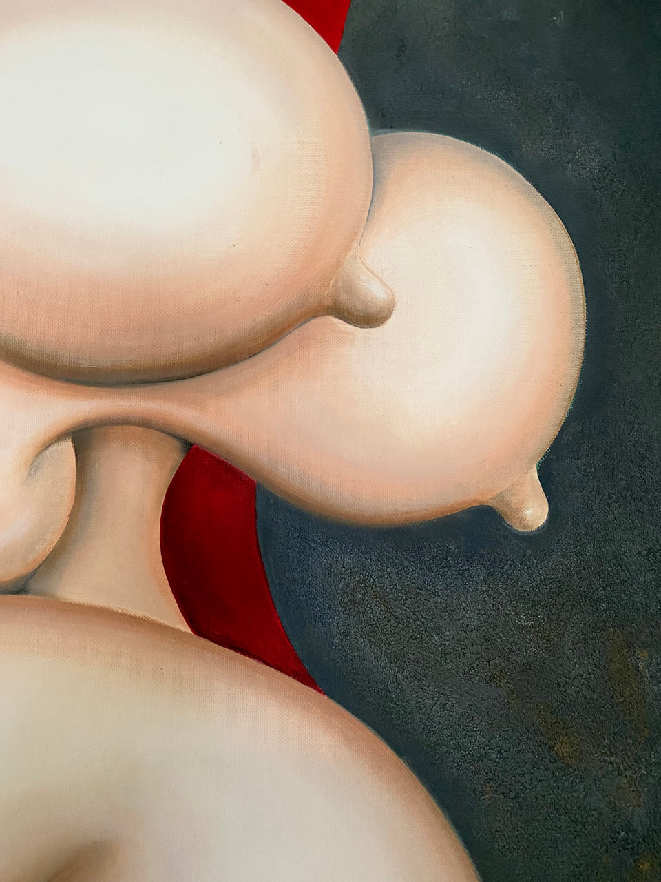 Female reclining on red chair